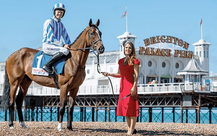 Horse and jockey in front of Brighton Pier