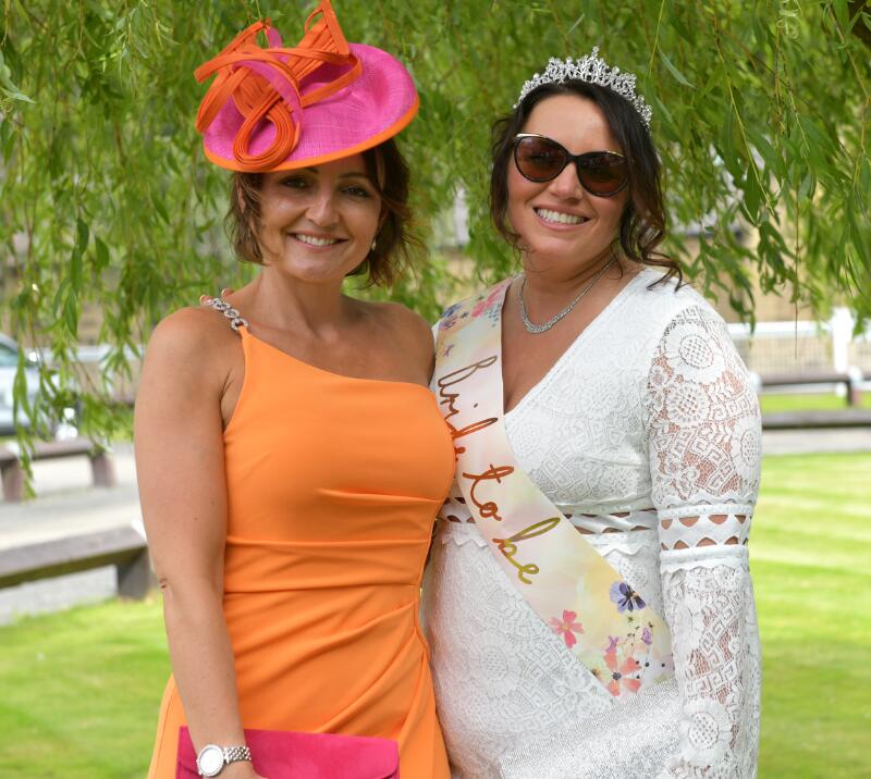 A bride to be attending the races.