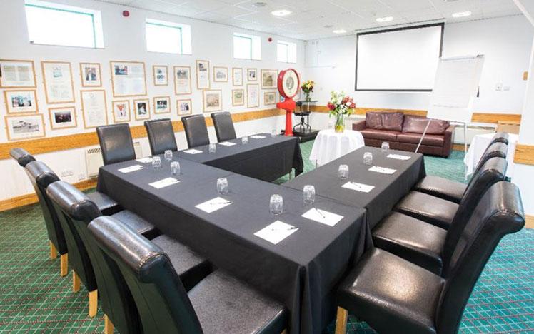 A room at Brighton Racecourse set-up for a conference