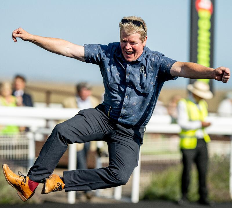 A guy kicking his heels at Brighton Races
