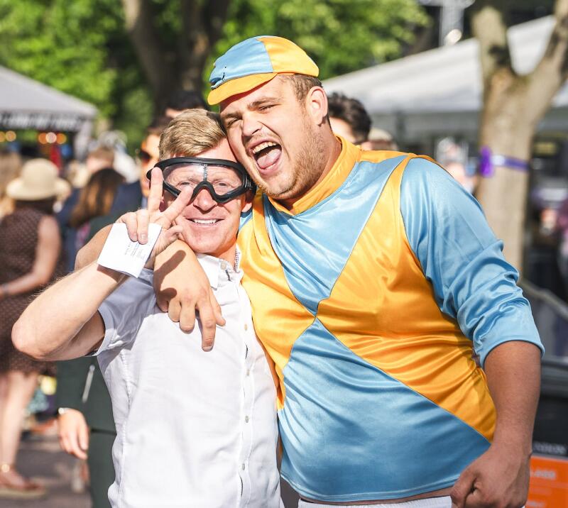 Racegoers in fancy dress as a jockey.